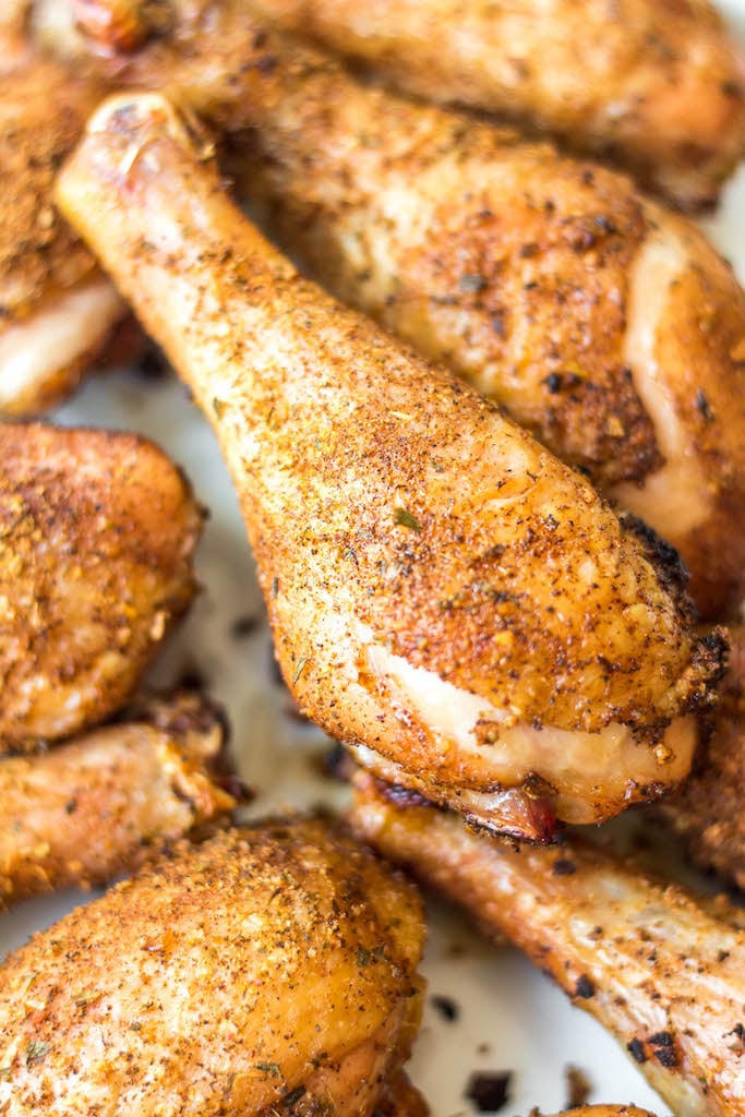 Having a go-to smoked chicken legs recipe is a must have for summer. These smoked chicken legs use very few staple ingredients and is gluten free and dairy free. It's the perfect choice for a gathering, or for meal prep because it is super easy and fast. Smoked chicken drumsticks are a favorite for kids and adults alike and will be a versatile addition to your summer smoking. #smokerrecipes #chickenlegs #glutenfreerecipes #dairyfreerecipes #smokedchickenlegs #chickendrumsticks