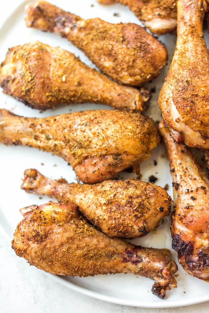 Having a go-to smoked chicken legs recipe is a must have for summer. These smoked chicken legs use very few staple ingredients and is gluten free and dairy free. It's the perfect choice for a gathering, or for meal prep because it is super easy and fast. Smoked chicken drumsticks are a favorite for kids and adults alike and will be a versatile addition to your summer smoking. #smokerrecipes #chickenlegs #glutenfreerecipes #dairyfreerecipes #smokedchickenlegs #chickendrumsticks