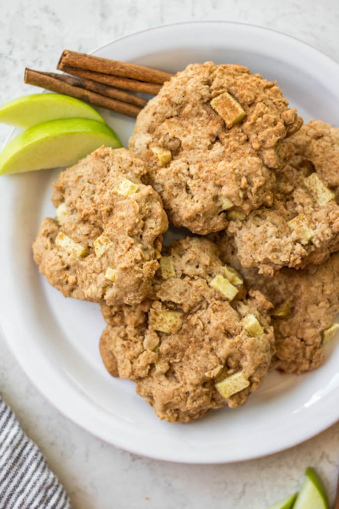 These gluten free apple cinnamon oatmeal cookies are great any day of the year, but they're absolutely perfect in the fall! These apple oatmeal cookies are chewy and soft, use minimal ingredients and have just the right amount of apple and cinnamon. They only take a few minutes to prepare and 15 minutes to bake! #applecinnamon #fallbaking #oatmealcookies #appleoatmealcookies