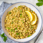 Instant Pot couscous is the best choice for getting an easy side onto your table. This recipe is both dairy free and vegan and is ready in about 15 minutes so it's super quick. Use this recipe as a standalone side for dinner or in any scenario where you'd want a bed of pasta to top with your favorite sauce, salad or recipe. #couscous #pressurecookerrecipes #veganrecipes #dairyfreerecipes #healthypastarecipes #healthyrecipes