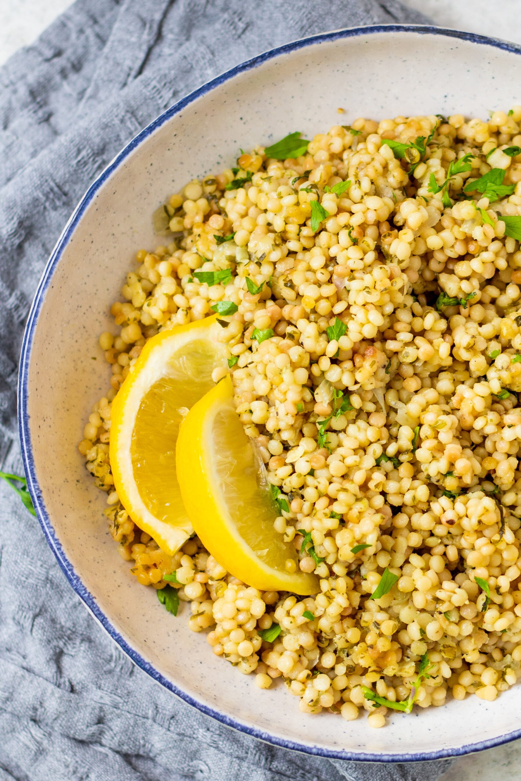 Instant Pot couscous is the best choice for getting an easy side onto your table. This recipe is both dairy free and vegan and is ready in about 15 minutes so it's super quick. Use this recipe as a standalone side for dinner or in any scenario where you'd want a bed of pasta to top with your favorite sauce, salad or recipe. #couscous #pressurecookerrecipes #veganrecipes #dairyfreerecipes #healthypastarecipes #healthyrecipes