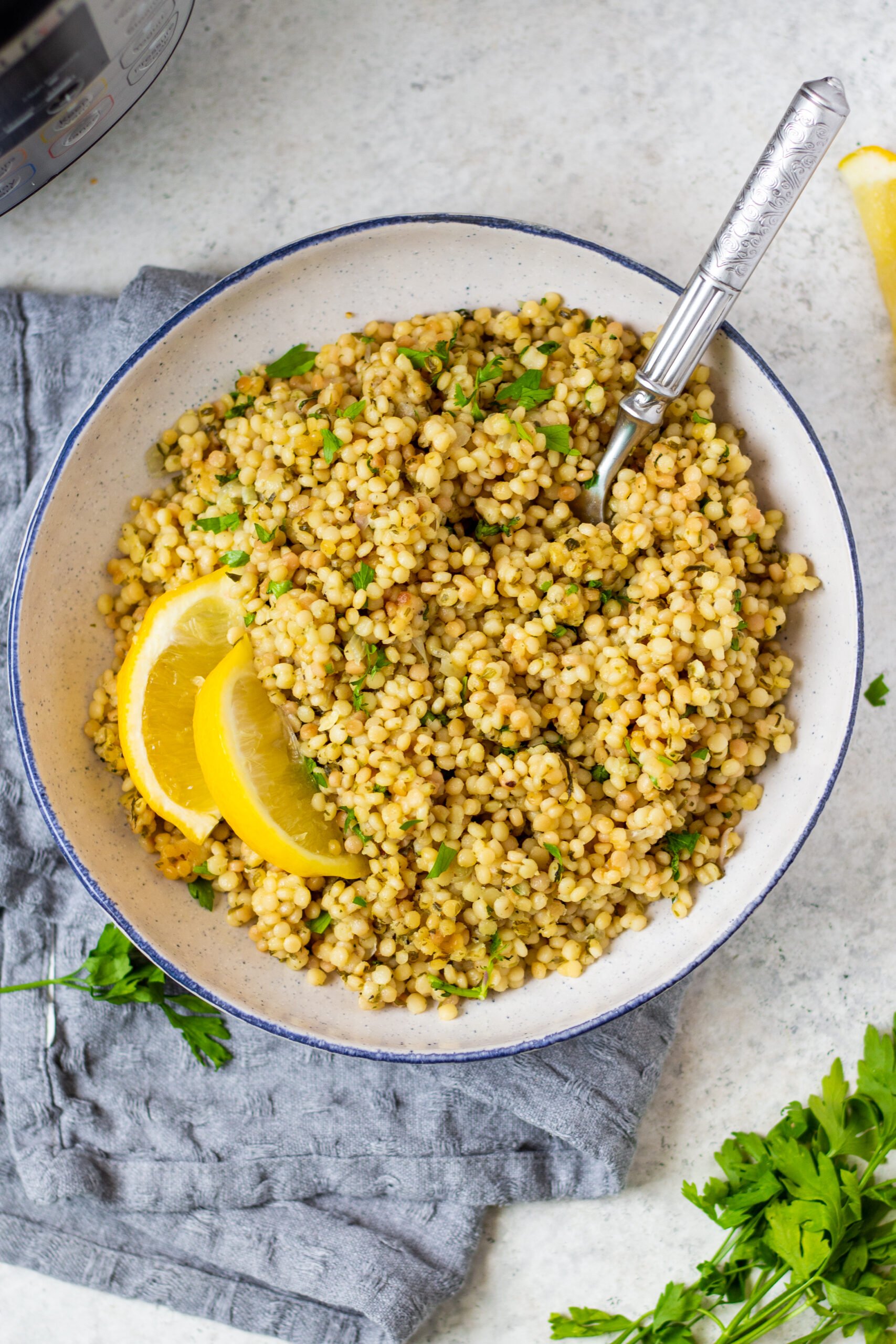 Instant Pot couscous is the best choice for getting an easy side onto your table. This recipe is both dairy free and vegan and is ready in about 15 minutes so it's super quick. Use this recipe as a standalone side for dinner or in any scenario where you'd want a bed of pasta to top with your favorite sauce, salad or recipe. #couscous #pressurecookerrecipes #veganrecipes #dairyfreerecipes #healthypastarecipes #healthyrecipes