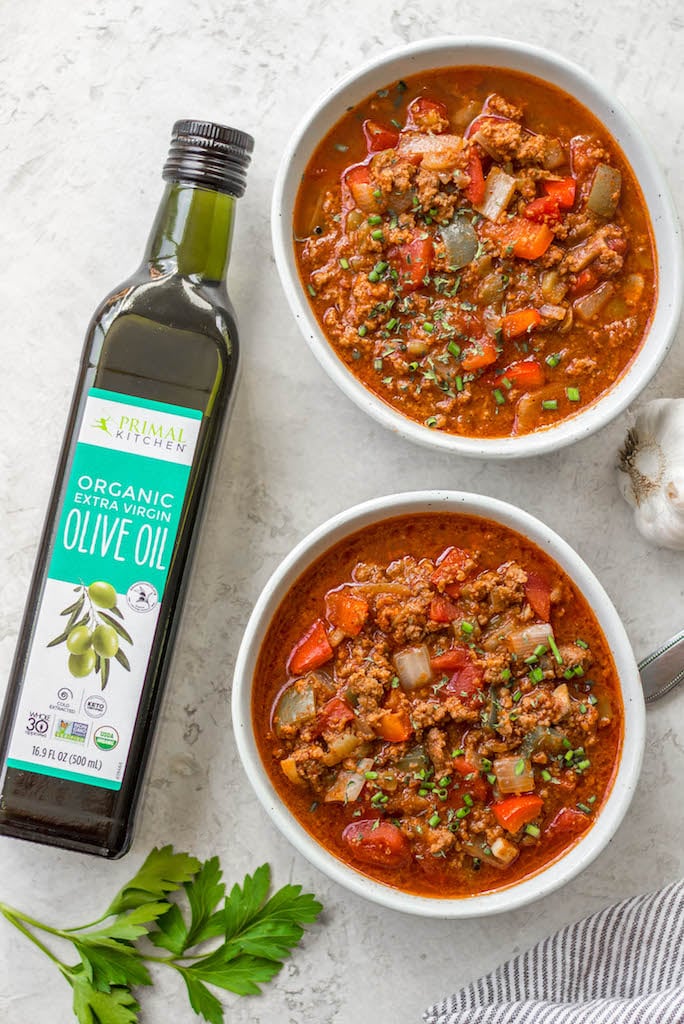 This beanless chili recipe is a quick and easy stovetop meal that cooks in just 30 minutes! It's Whole30, paleo, low carb and gluten-free, so it's a no bean chili that everyone can enjoy! Made with hearty vegetables like tomatoes, peppers, onions and mushrooms it's super filling without beans and makes delicious leftovers for meal prep or freezing. #beanlesschili #whole30chili #stovetopchili #ketochili #lowcarbchili