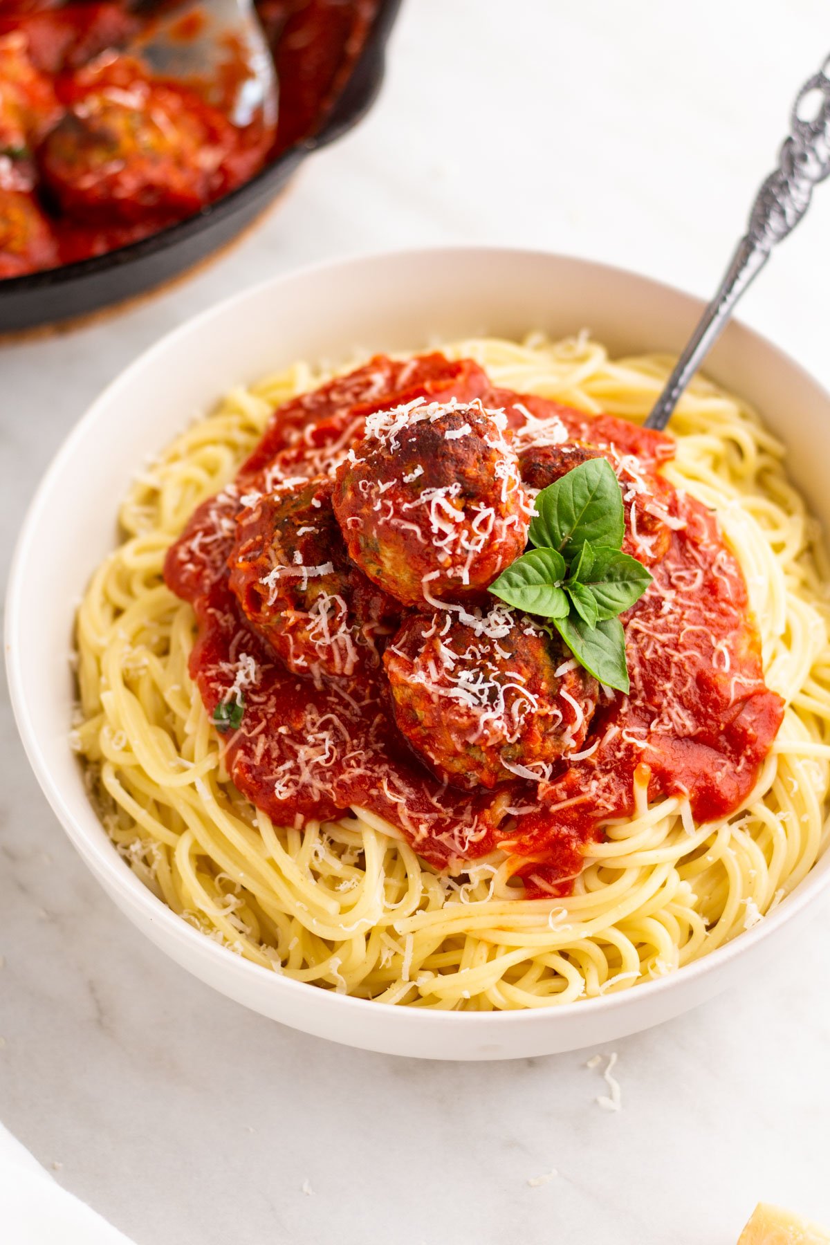Ricotta meatballs is an upgraded recipe for a must have recipe in your arsenal: meatballs. These cheesy meatballs can be easily made gluten free and can be all beef or all pork to fit your preference. This recipe makes a generous portion and is absolutely perfect for meal prep, family gatherings, or a simple dinner at home. Ricotta meatballs are versatile and can go with or on anything you like to add meatballs to. It's delicious, easy, and a classic all in one. #glutenfreerecipes #easydinnerrecipes #meatballs #ricotta #skilletrecipes