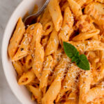 Pink sauce pasta is a simple pasta dish that is quick to make and can easily be made gluten free. This recipe is a classic and is perfect for meal prepping or a simple dinner at home. The homemade pink sauce is simple to make and can be swapped in anywhere you would normally use a pasta sauce and want the pink sauce flavor. You can even make pink sauce ahead of time and have it on hand for a pink sauce pasta later in the week. #glutenfreerecipes #pastarecipes #easydinnerrecipes #pinksaucepasta #pasta