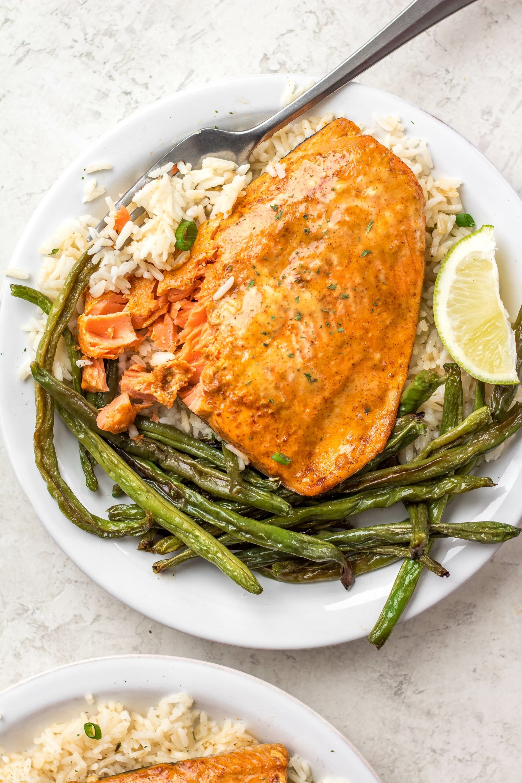 Bang Bang salmon with homemade Bang Bang sauce is both dairy free and gluten free. It takes about 10 minutes to cook and uses only a few easy ingredients. Made in the oven on a sheet pan, it's a breeze for cleanup and makes for an easy win for meal prep or dinner anytime. #homemadebangbangsauce #glutenfreesalmon #diaryfreesalmon #salmonrecipes #10minutemeals #bangbangsalmon