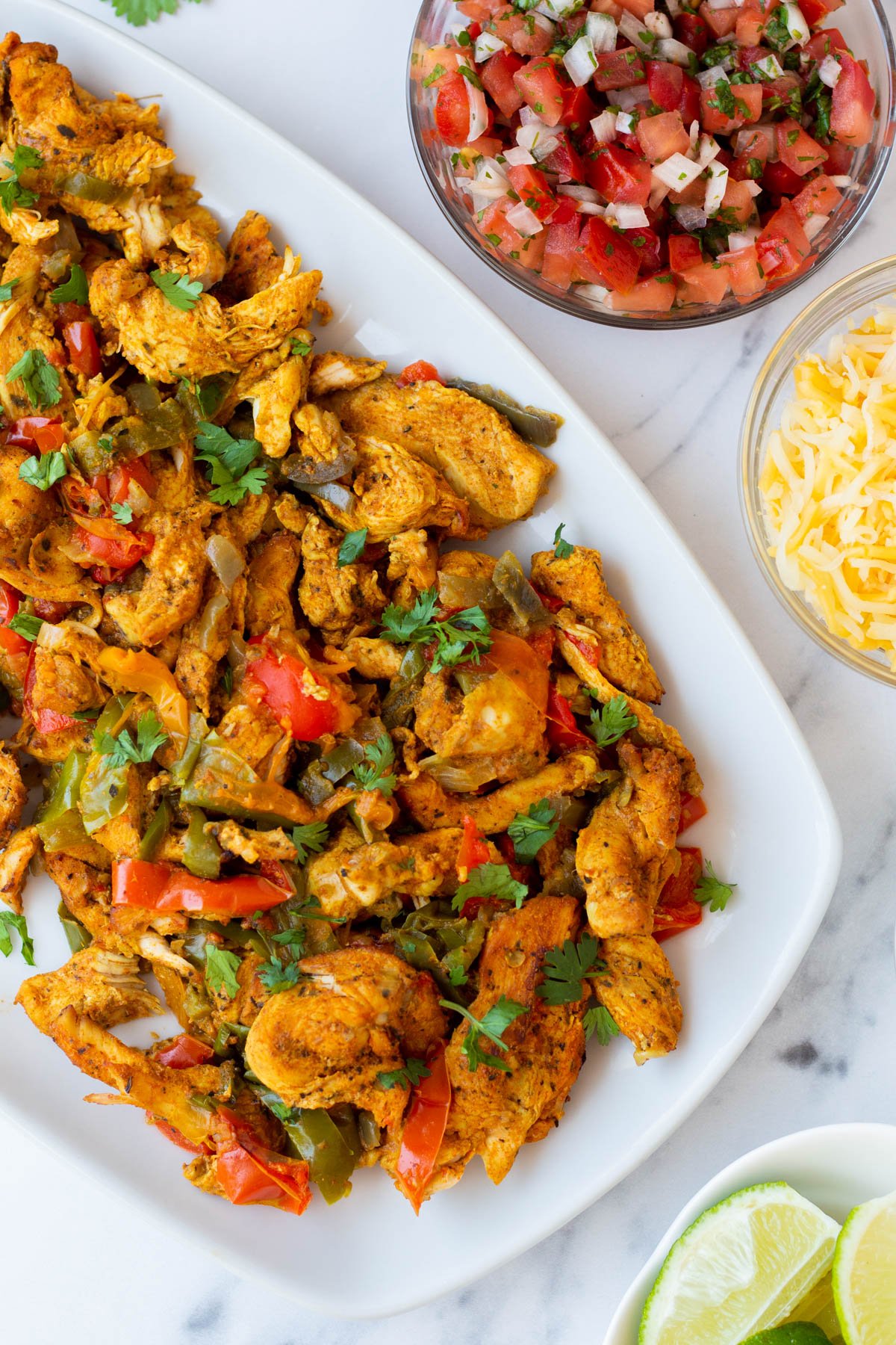 Instant Pot chicken fajitas are the perfect choice for both a quick dinner and for meal prepping. These tasty fajitas are ready in 10 minutes and are dairy free, gluten free, and low carb. The recipe requires only six ingredients and you can customize it to make your perfect fajita. #10minutemeals #glutenfreerecipes #diaryfreerecipes #glutenfreedairyfreerecipes #lowcarbrecipes #instantpotrecipes #chickenfajitas #pressurecookerrecipes #easymealprep